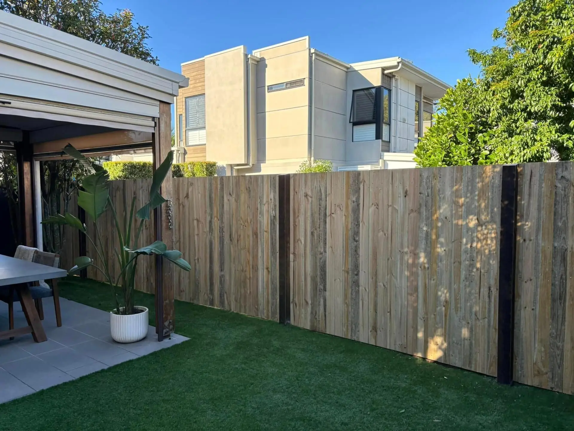 Hardwood paling fence in a modern Bayside backyard with steel posts